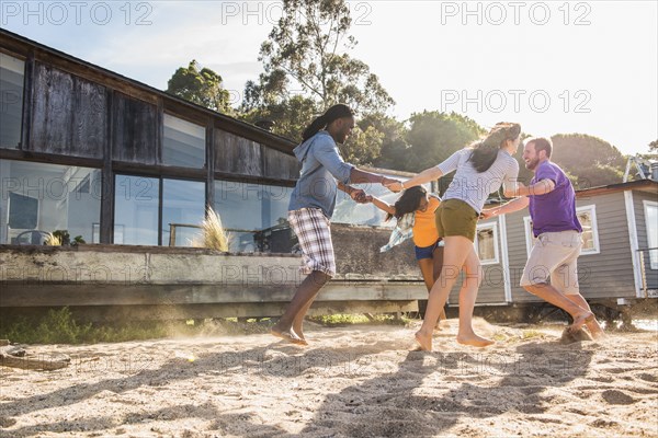 Friends playing in sand