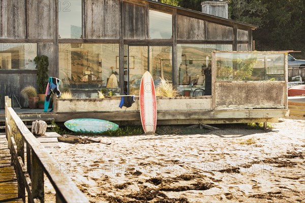 Surfboards in backyard of beach house