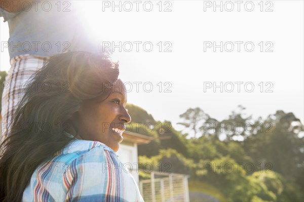 Smiling woman sitting outdoors