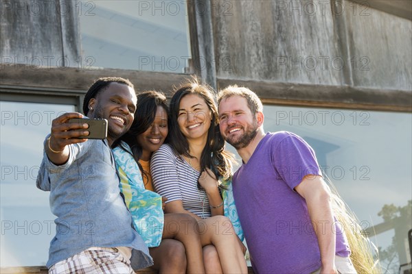 Friends taking selfie outdoors