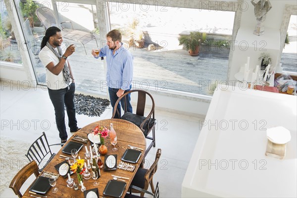 Men drinking in dining room