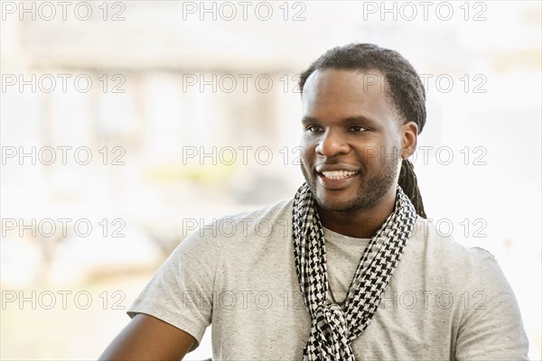 African American man smiling indoors