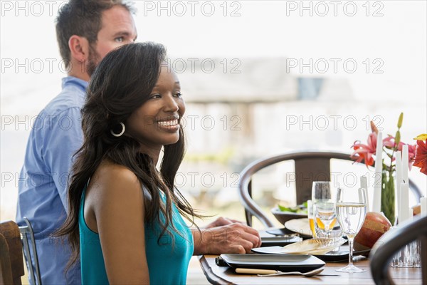 Couple smiling at dining room table