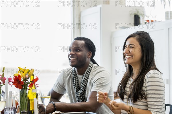 Couple smiling at dining room table