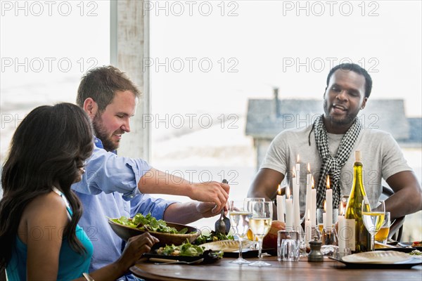 Friends eating at dinner party