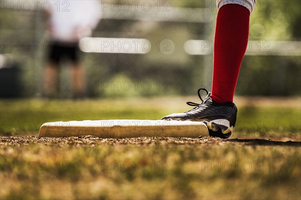 Baseball player touching base