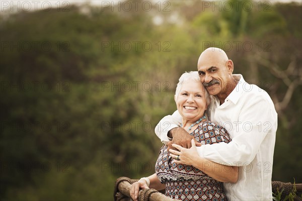 Couple hugging on balcony