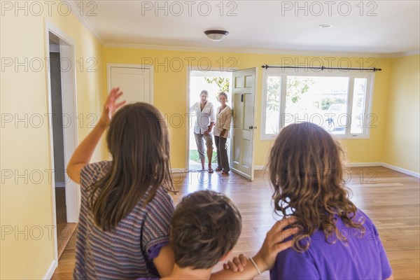 Family admiring new home