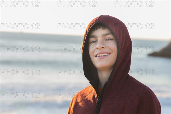 Mixed race boy smiling outdoors