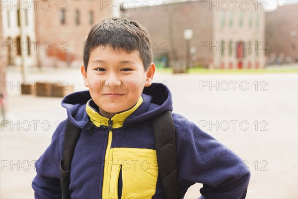 Hispanic boy smiling outdoors