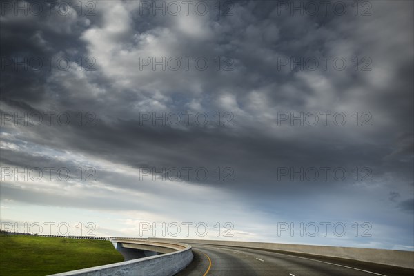 Clouds over winding highway