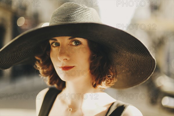 Caucasian woman wearing sun hat