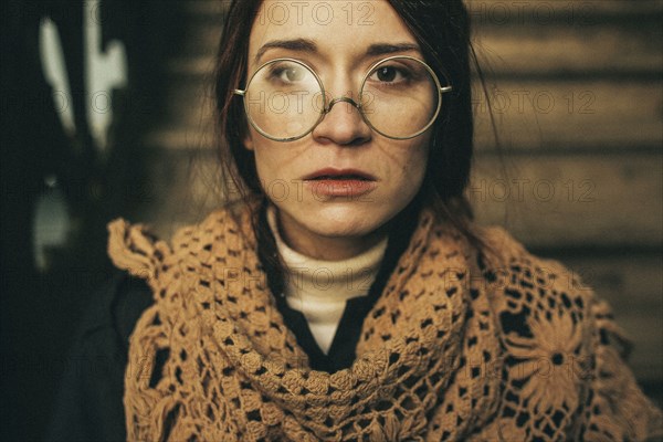 Caucasian woman wearing scarf and eyeglasses