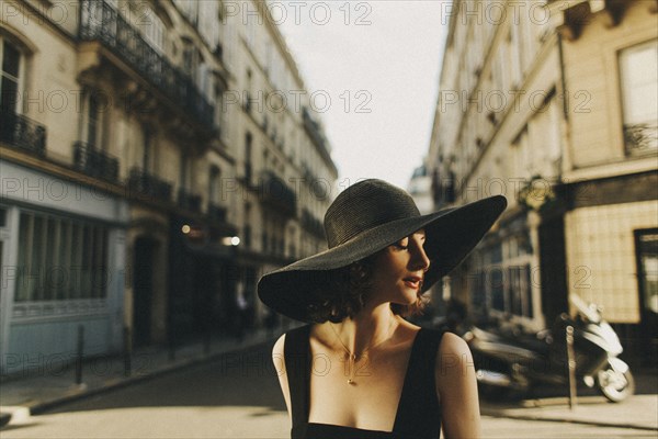 Glamorous Caucasian woman standing in city street