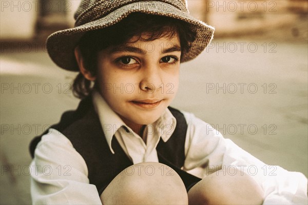 Old-fashioned Caucasian boy with black eye
