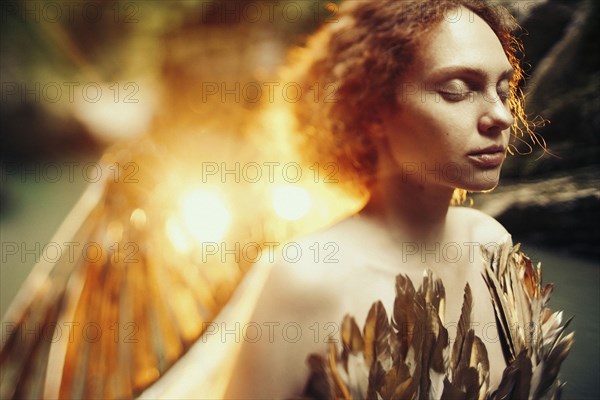 Caucasian woman with angel wings