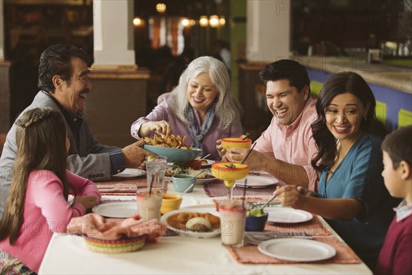 Family enjoying dinner in restaurant