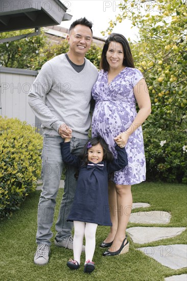 Portrait of parents and daughter