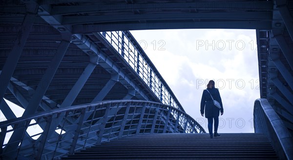 Girl walking on staircase