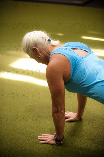 Older woman doing push-up