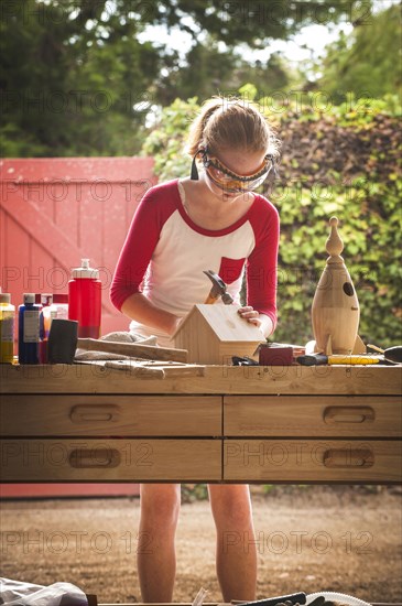 Girl hammering