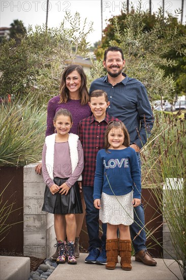 Portrait of smiling family in garden