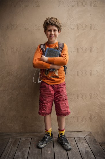 Portrait of smiling Caucasian boy holding book