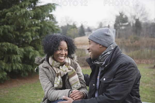 Couple sitting together in park