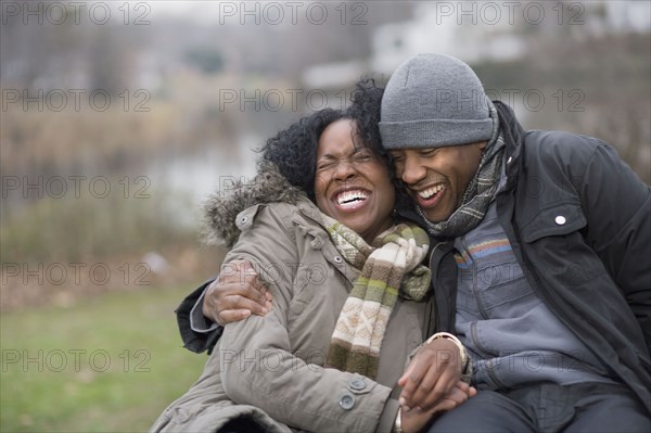 Couple laughing together outdoors