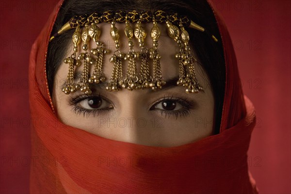 Middle Eastern woman in ornate headdress