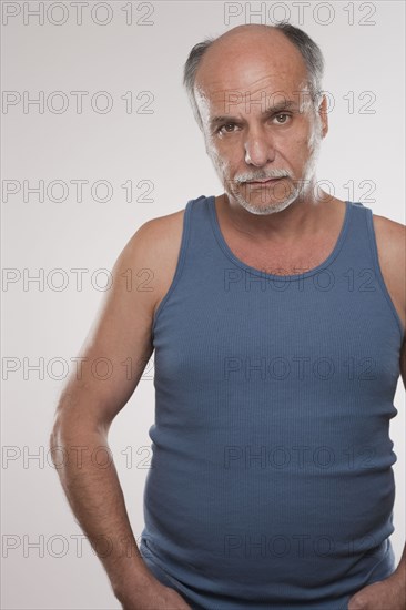 Serious Caucasian man in muscle-t