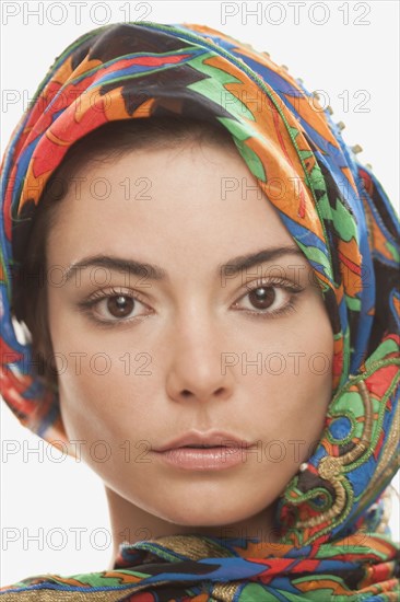 Serious Hispanic woman in elegant headdress
