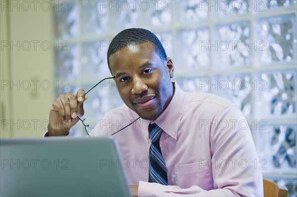 African American businessman sitting at desk