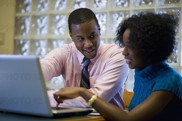 African American businessman working with female co-worker