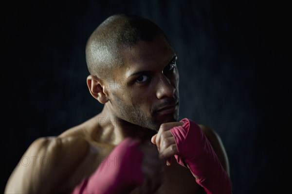 Hispanic boxer warming up