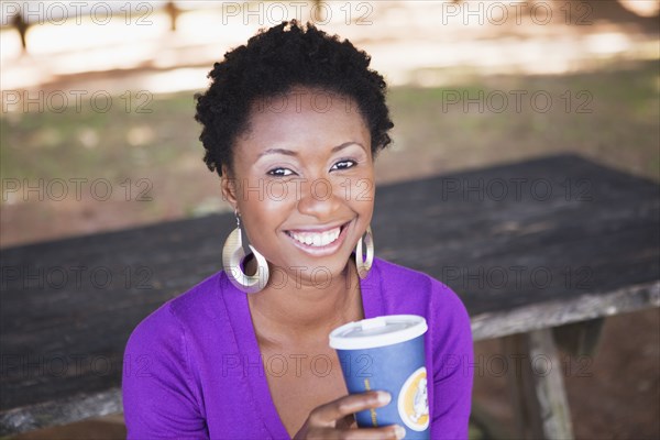 African American woman drinking coffee