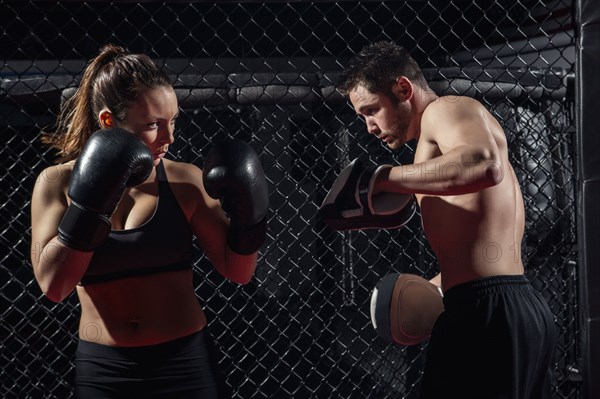 Caucasian fighters training in gym