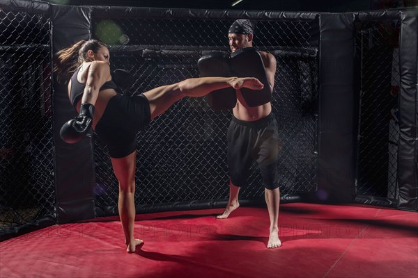 Caucasian fighters training in gym