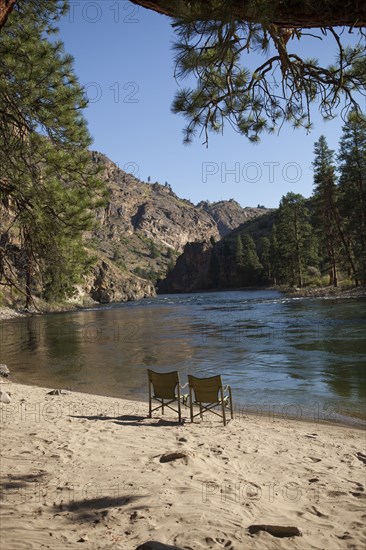 Two chairs on sandy remote beach