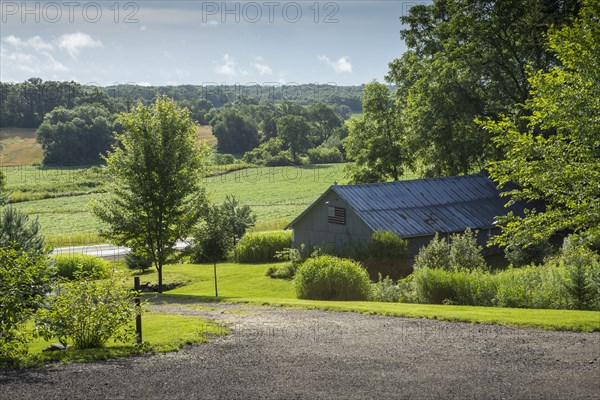 Barn building on farm in rural landscape