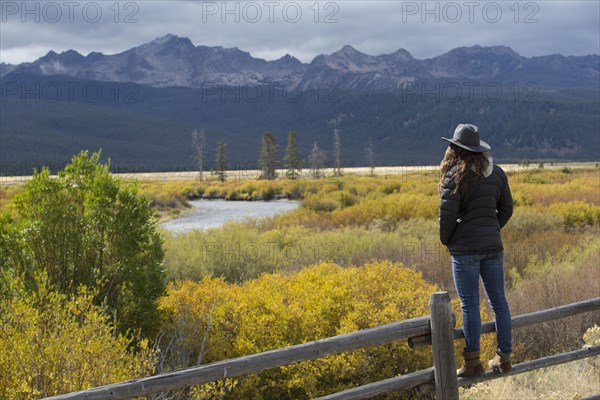 Caucasian woman admiring Sawtooth Range