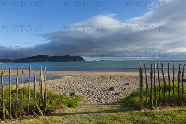 Wooden fence on remote beach