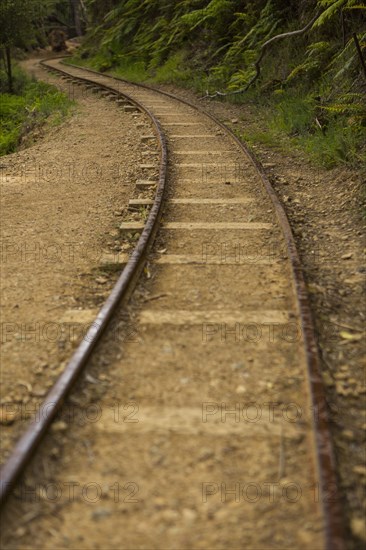 High angle view of train tracks in sand