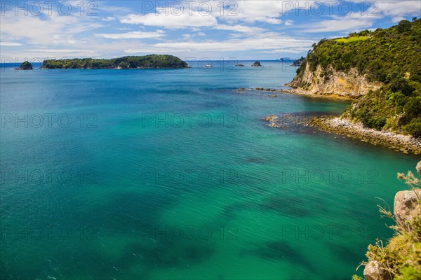 High angle view of remote cove and ocean horizon