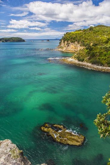 High angle view of remote cove and ocean horizon