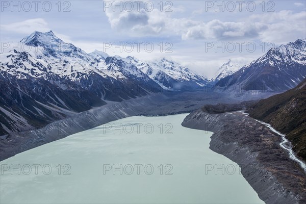 Remote mountains over frozen lake