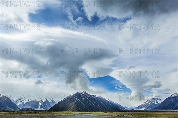 Cloudy sky over mountains and remote landscape