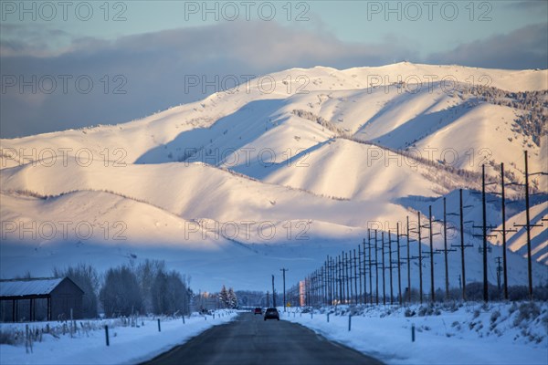 Snowy mountains over road in remote landscape