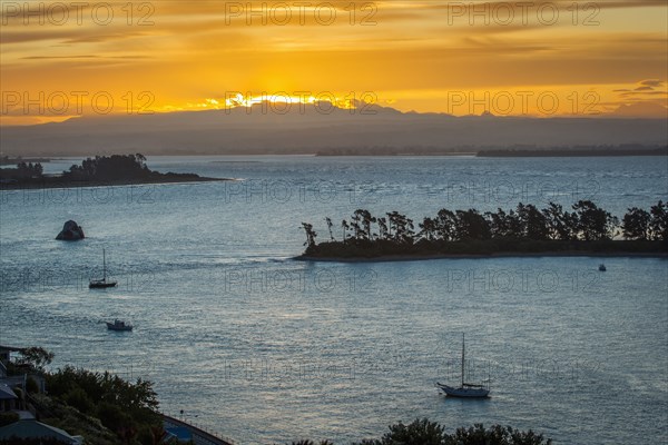 Aerial view of boats sailing near island sandbar