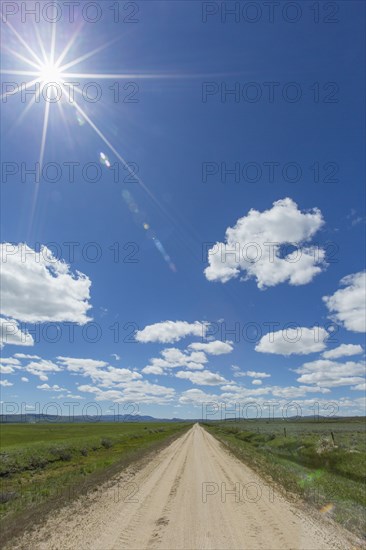 Dirt road toward mountains